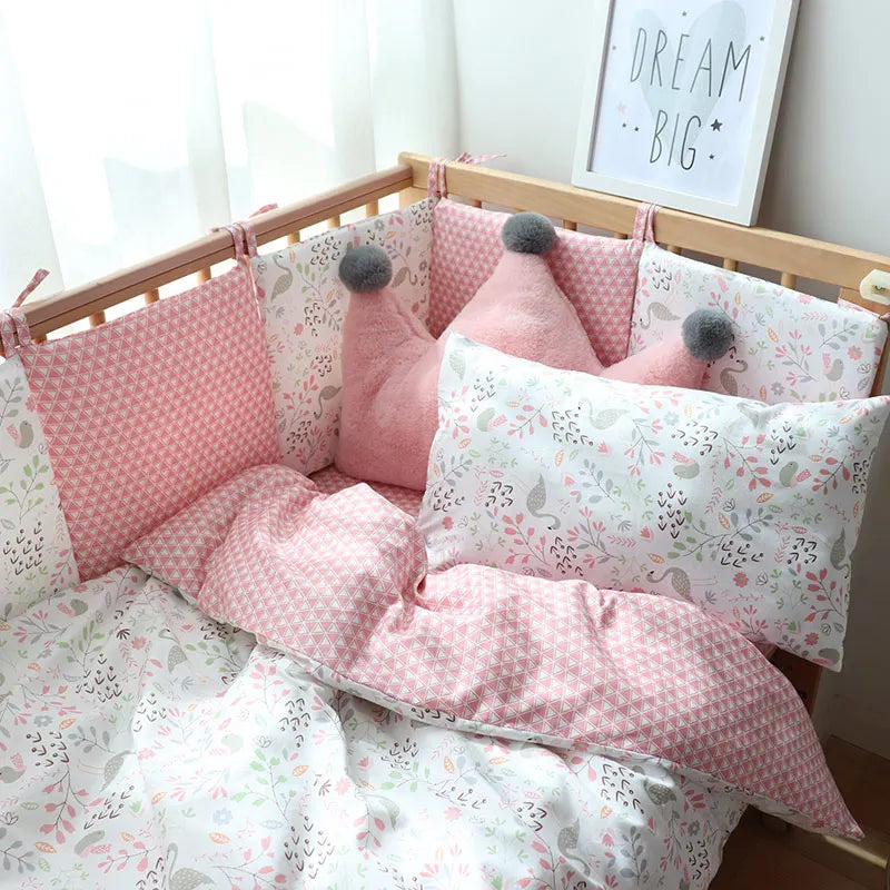 Soft cotton baby crib bedding set by Baby Bubble, nursery bundle with cozy sheets, pillow, and blanket in gentle pastel colors.