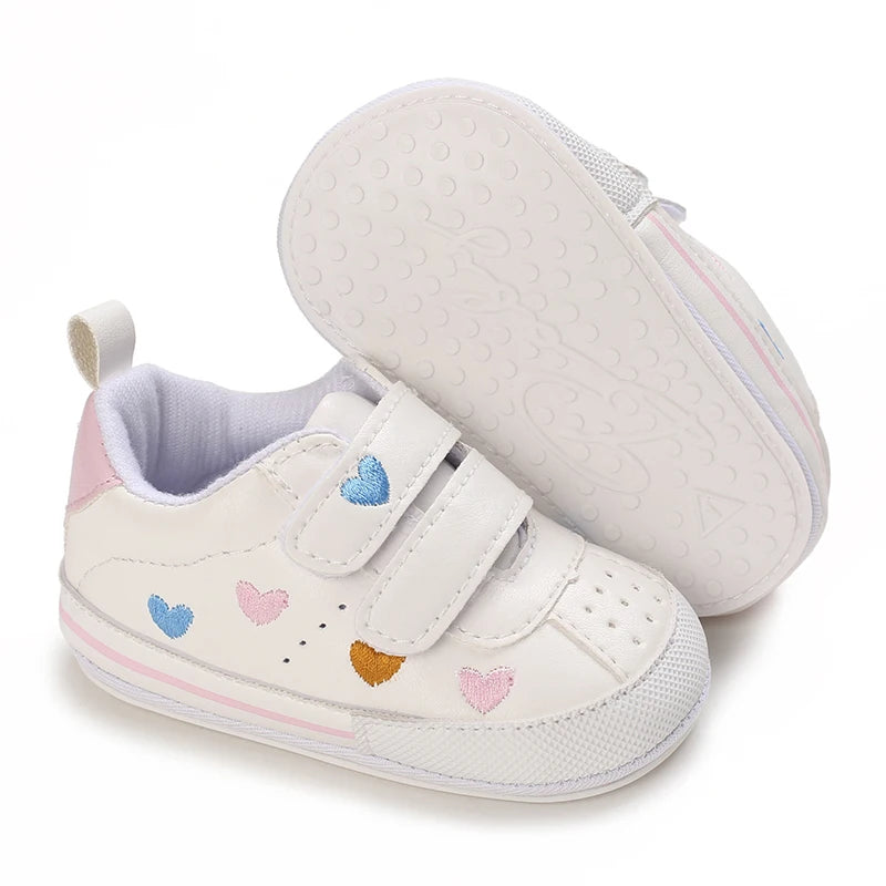 Baby girl soft sole crib shoes by Baby Bubble, featuring pink and white design perfect for first walker and early steps.
