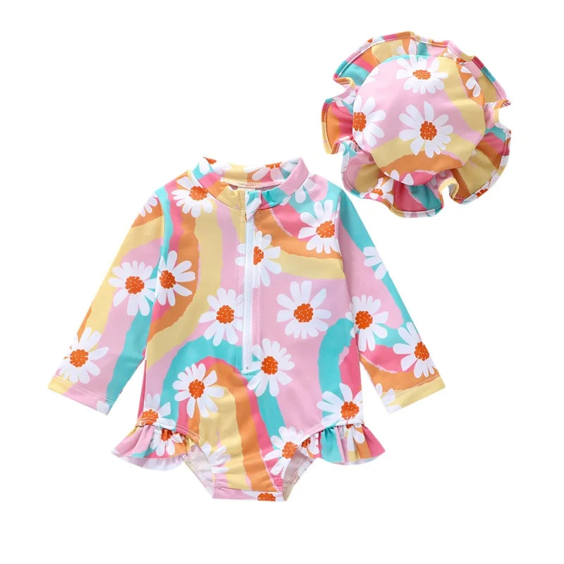 Baby Girl UV swimsuit with hat by Baby Bubble, long sleeve design with zipper, shown in a vibrant print, ideal for sun protection.
