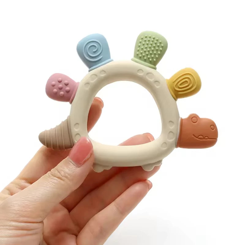 Baby Bubble BPA-free baby dinosaur teether with easy-grip design for soothing gums, featuring colorful dinosaur shape and textured surface.