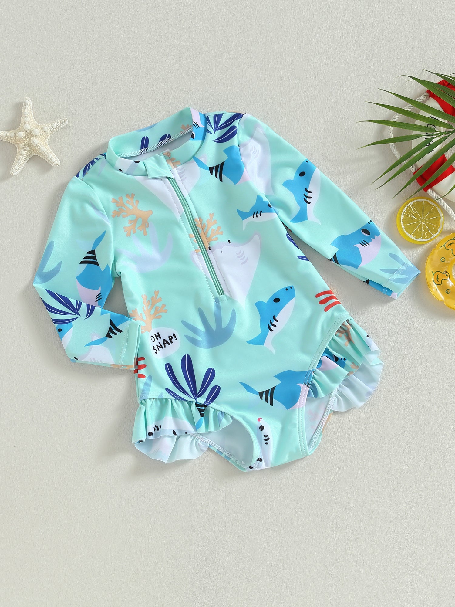 Girls long sleeve swimsuit with sea animal print by Baby Bubble, featuring colorful aquatic creatures on a lightweight fabric.