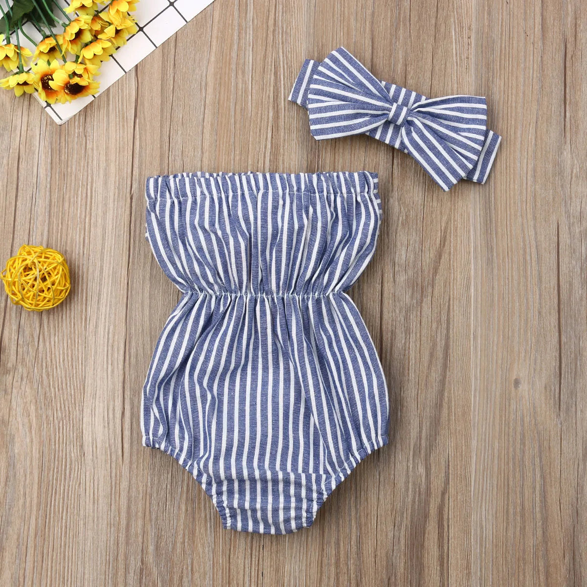 Baby Girl Summer Romper by Baby Bubble featuring a cute striped design, lightweight fabric, perfect for warm weather.