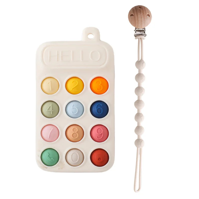 Baby Bubble BPA-free silicone teether glove with textured surface for soothing baby's gums, shown on a gentle background.