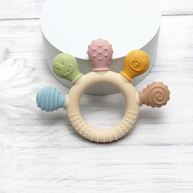 Colorful silicone baby ring teether from Baby Bubble, designed as a gum soother for soothing teething discomfort.