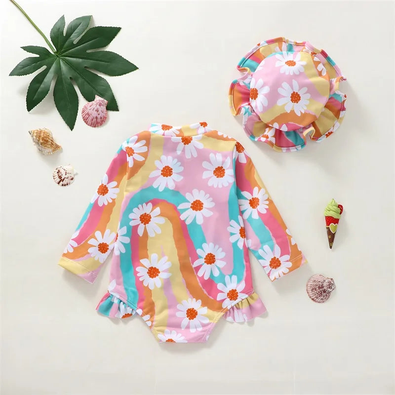 Baby Girl UV swimsuit with long sleeves and hat by Baby Bubble, featuring a front zipper and sun protection design.