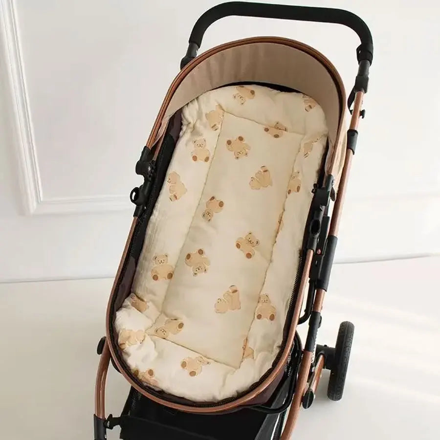 Soft cartoon-themed baby stroller strap cover by Baby Bubble, providing comfortable shoulder padding for little ones.