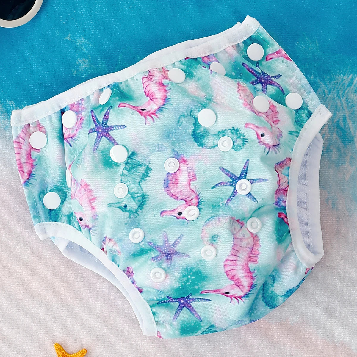 Baby Bubble washable and adjustable baby swim diapers shown in blue with elastic waist and snug fit, designed for comfortable swimming.