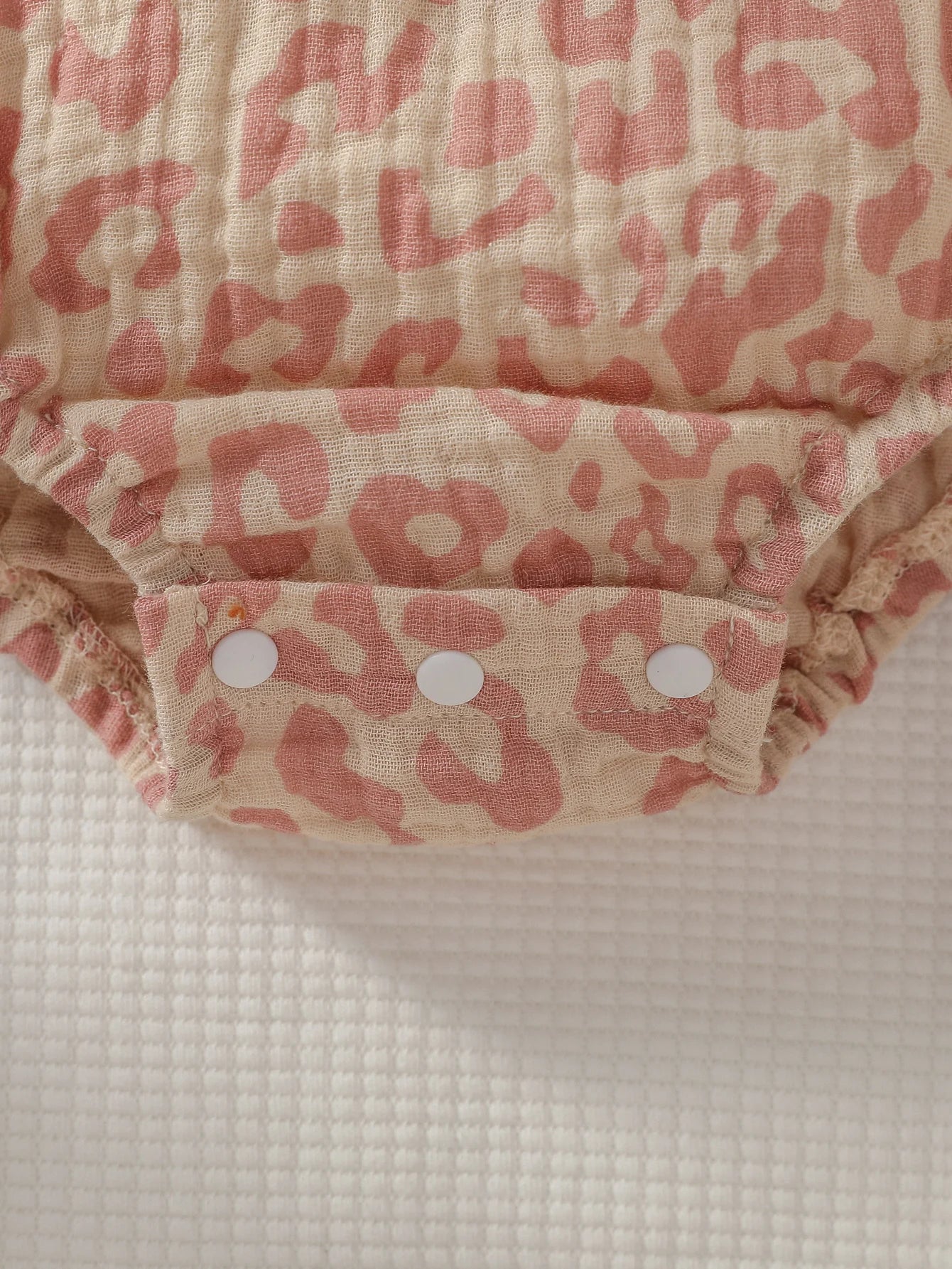 Baby Girl Summer Pink Jumpsuit with bow details, paired with matching headband, by Baby Bubble. Ideal for warm weather.