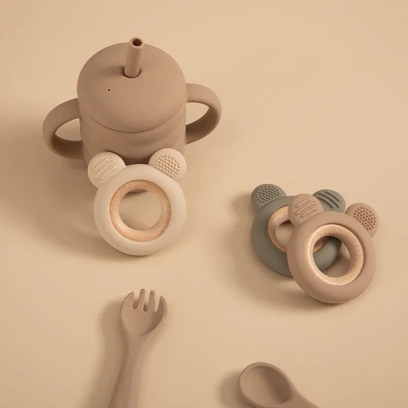 Baby Bubble silicone wood teether ring, a safe soothing chew toy with natural wood and soft silicone for babies to chew on.