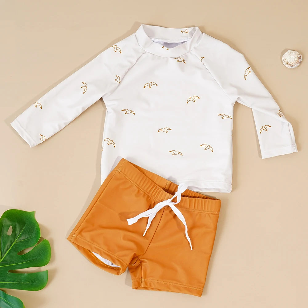 Baby boys' 2-piece swimsuit set with a cool print from Baby Bubble, featuring a sleeveless top and matching swim shorts.