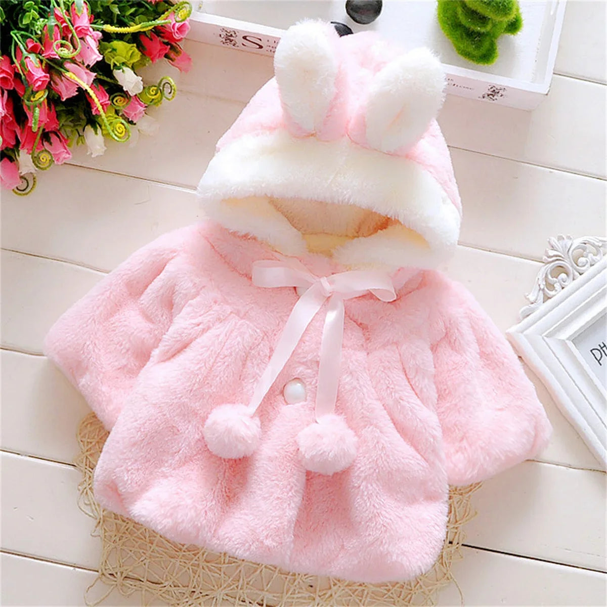 Girls wool cape by Baby Bubble featuring a cozy winter design in soft, warm fabric with stylish detailing.