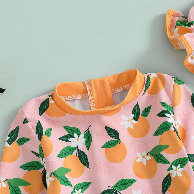 Baby Girl rash guard swimsuit with matching swim cap by Baby Bubble, featuring vibrant colors and sun protection for swimming.