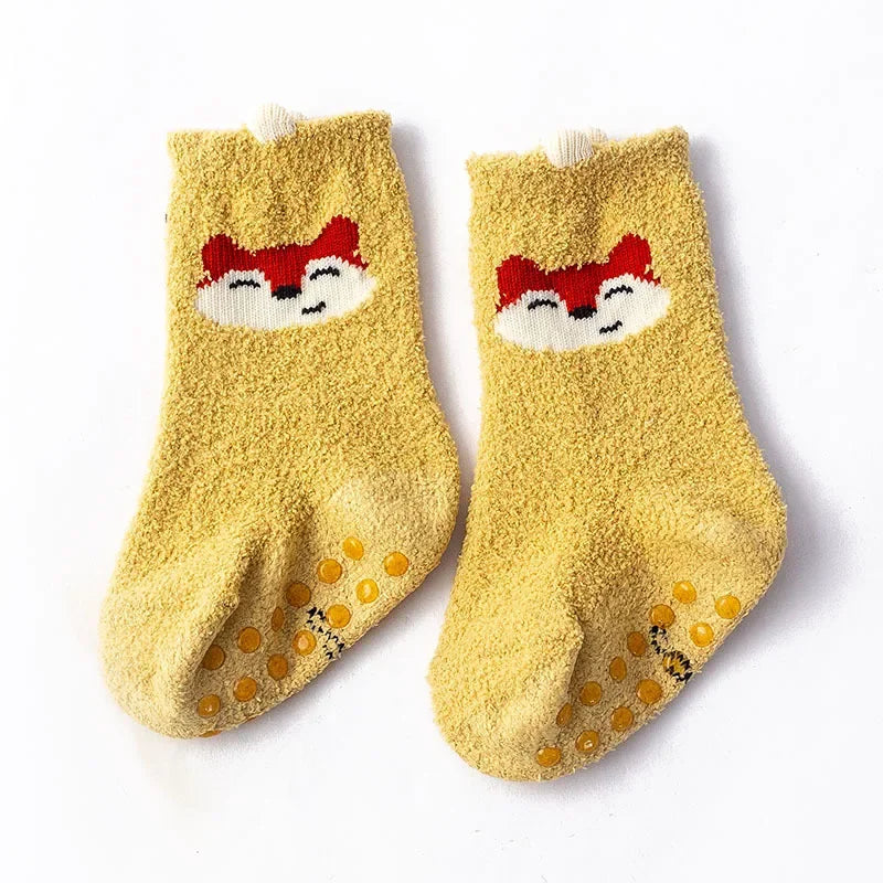 Baby Bubble baby dinosaur socks in soft, warm fabric with colorful dinosaur patterns, perfect for little feet.
