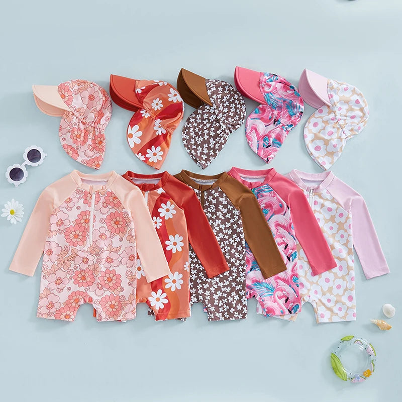 Baby girls rash guard set with floral and flamingo print by Baby Bubble, featuring short sleeves and colorful tropical design.