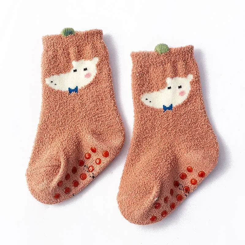 Baby Bubble baby dinosaur socks in soft, warm fabric with colorful dinosaur patterns on white background.