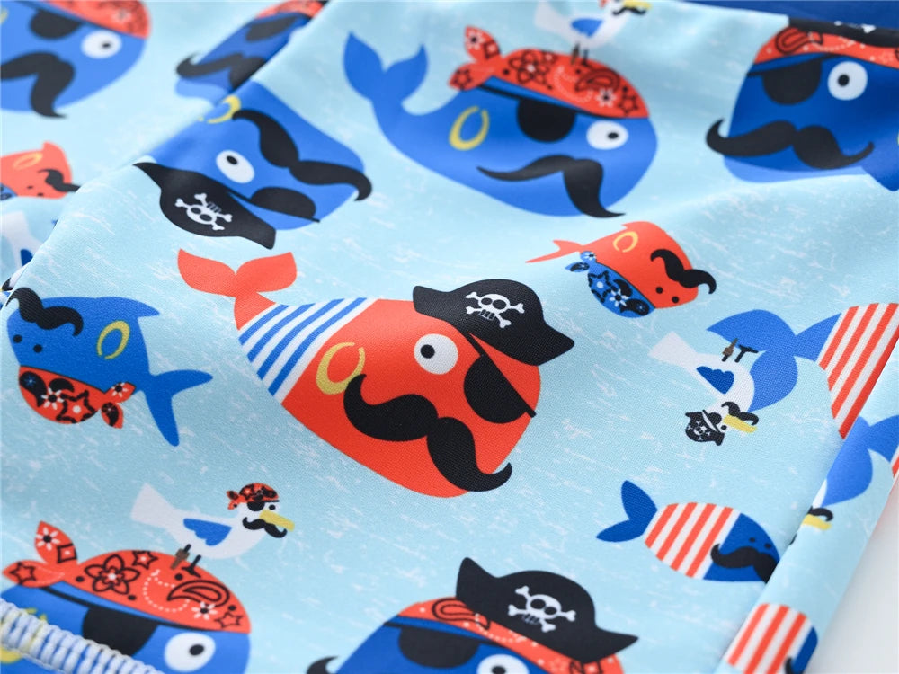 Boy wearing Baby Bubble boys 2-piece swimsuit set with cool print, suitable for ages 1 to 7, featuring colorful swimwear design.