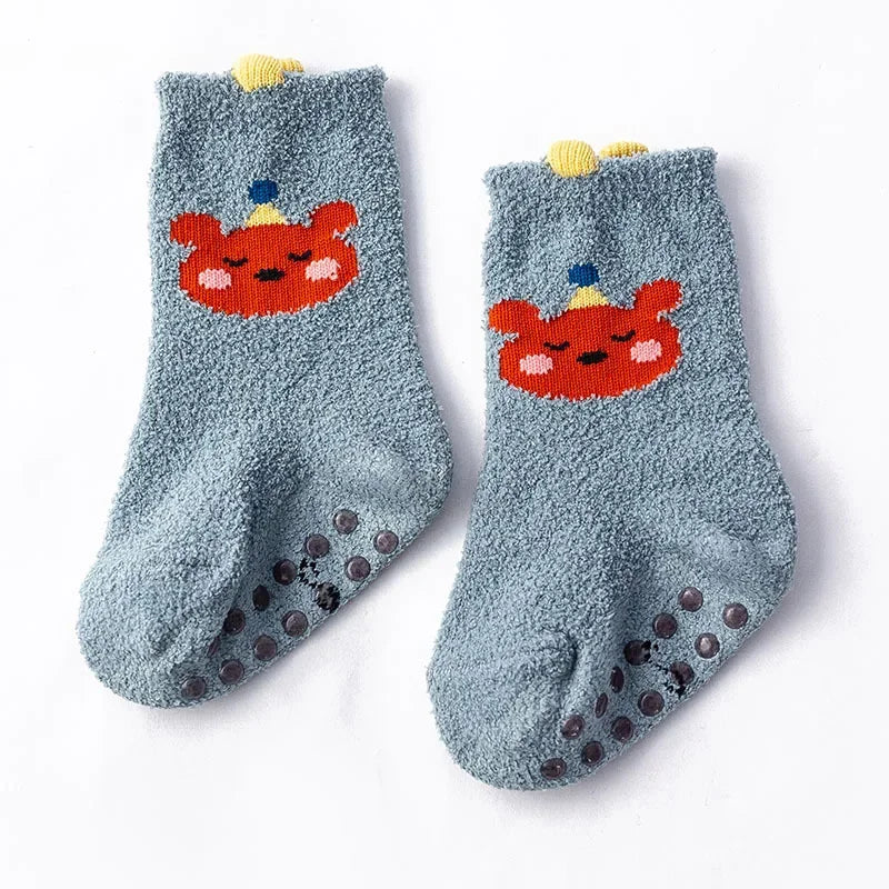 Baby Dinosaur socks by Baby Bubble featuring colorful, soft, warm baby socks with dinosaur patterns for infants.