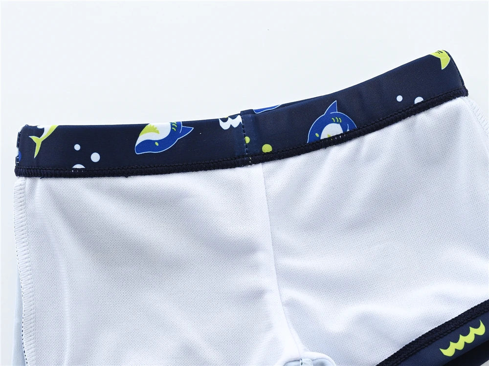 Baby Bubble boys' 2-piece swimsuit set with cool print for ages 1 to 7, featuring a colorful swim top and matching swim trunks.