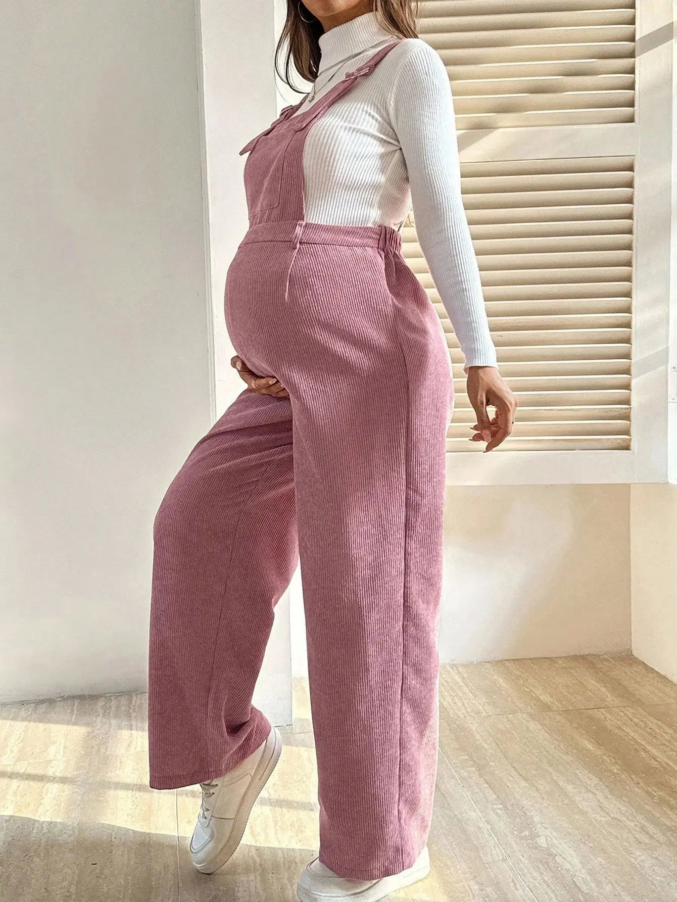 Baby Bubble maternity corduroy jumpsuit with suspenders, featuring a cozy, stylish design for comfortable pregnancy wear.