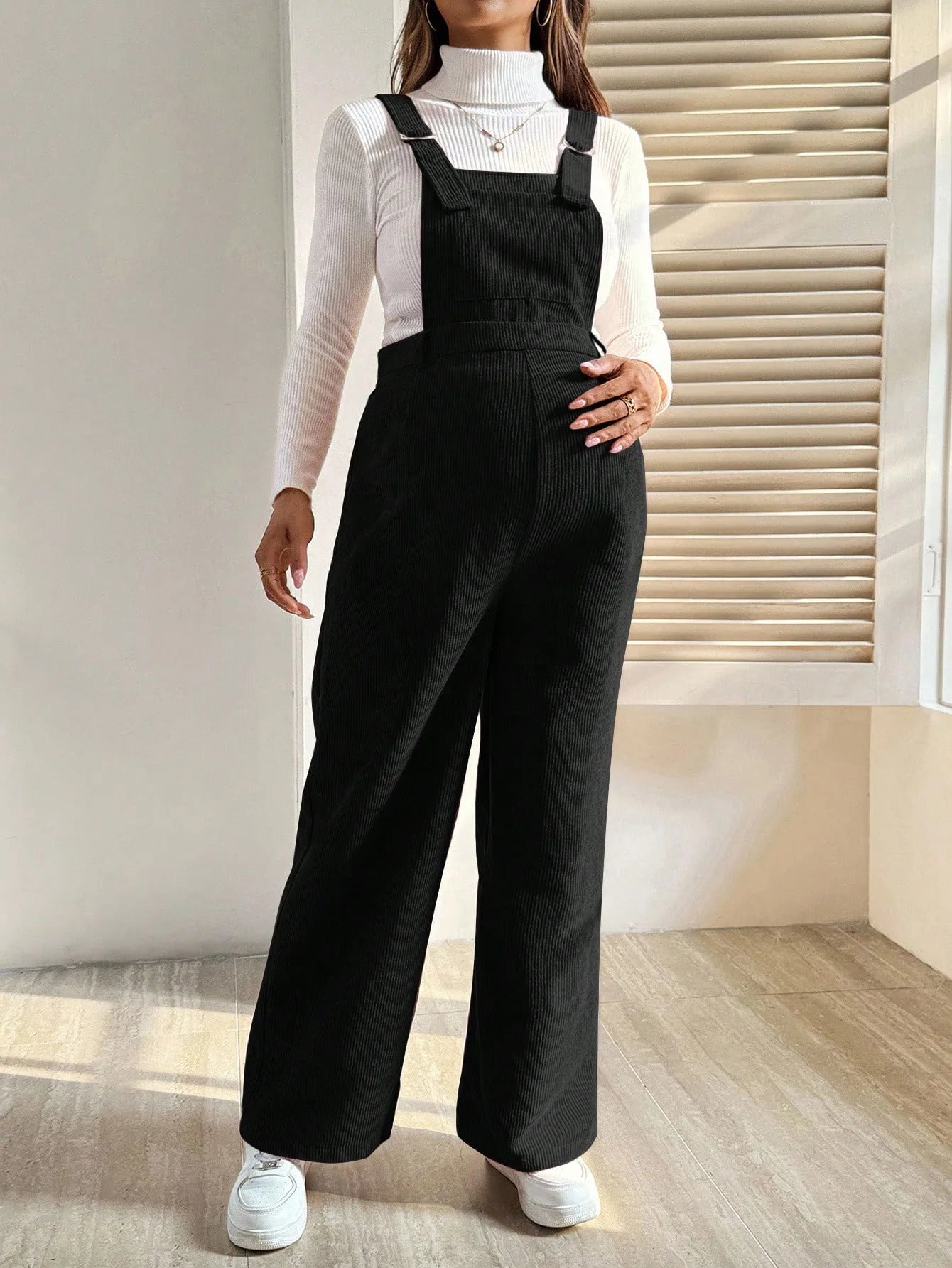 Baby Bubble maternity corduroy jumpsuit with suspender pants, featuring a cozy, stylish design for expecting mothers.