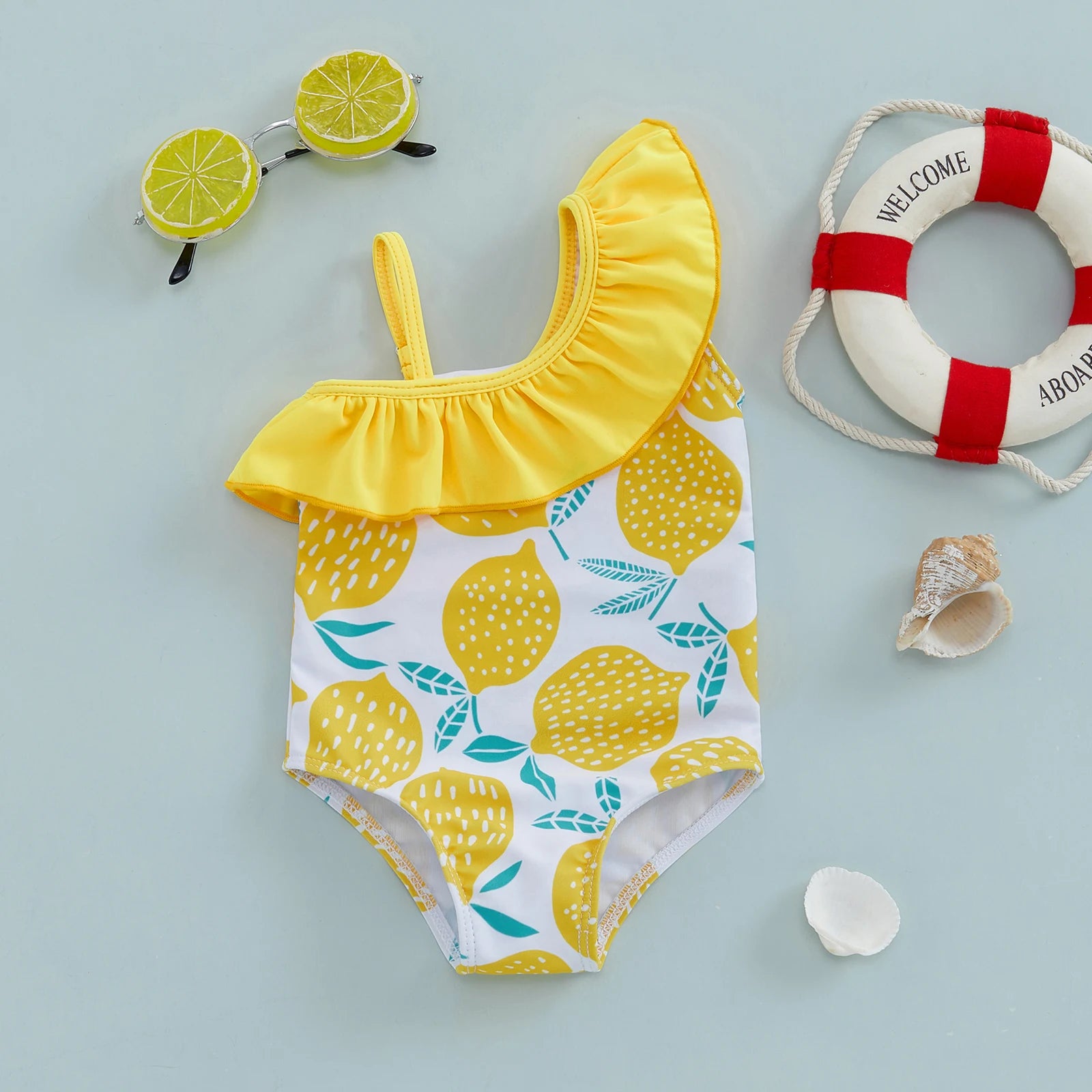 Baby Girls one-shoulder swimsuit with lemon print by Baby Bubble, featuring a cute and colorful summer swimwear design.