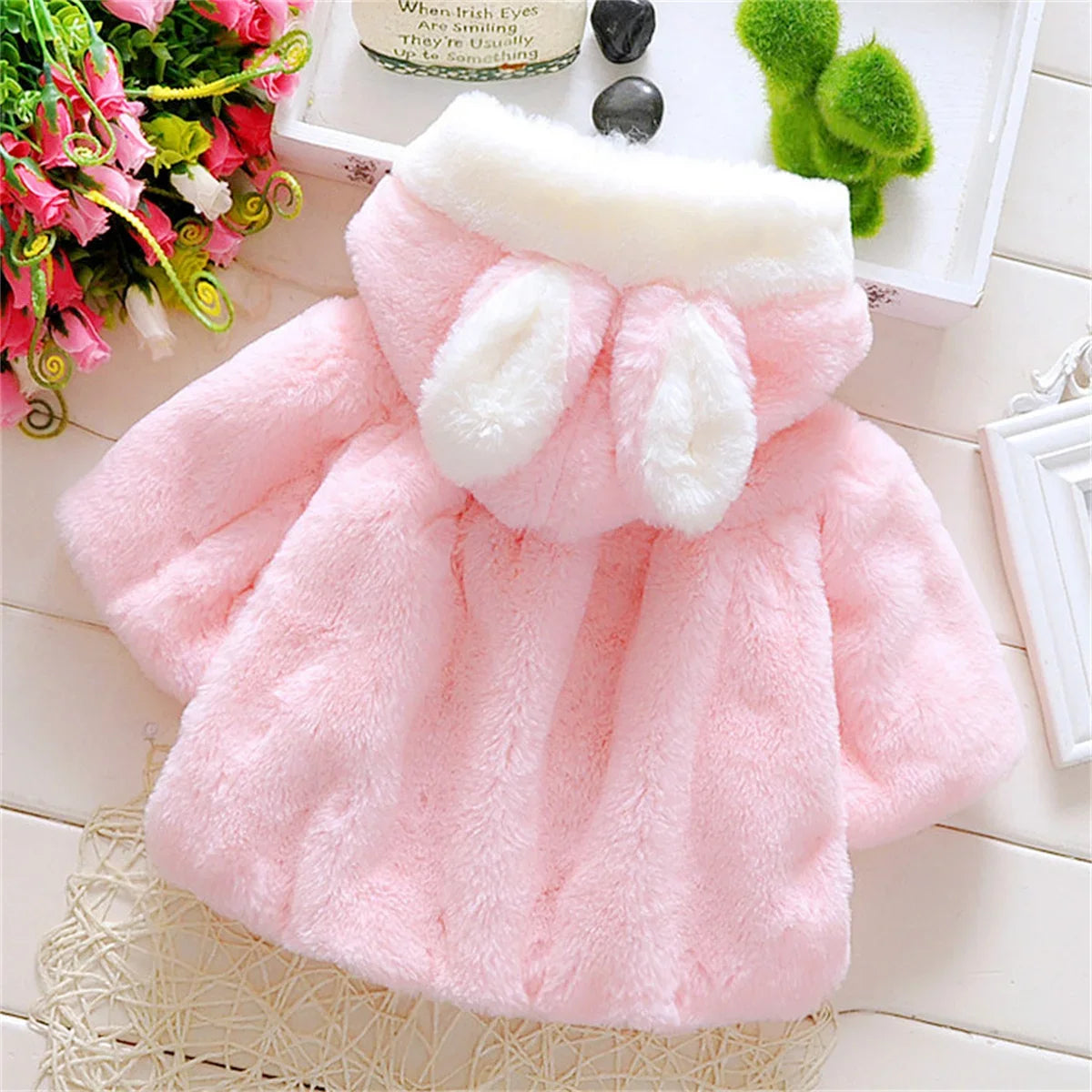 Girls wool cape by Baby Bubble featuring a cozy, stylish winter design with a soft wool texture and vibrant color details.