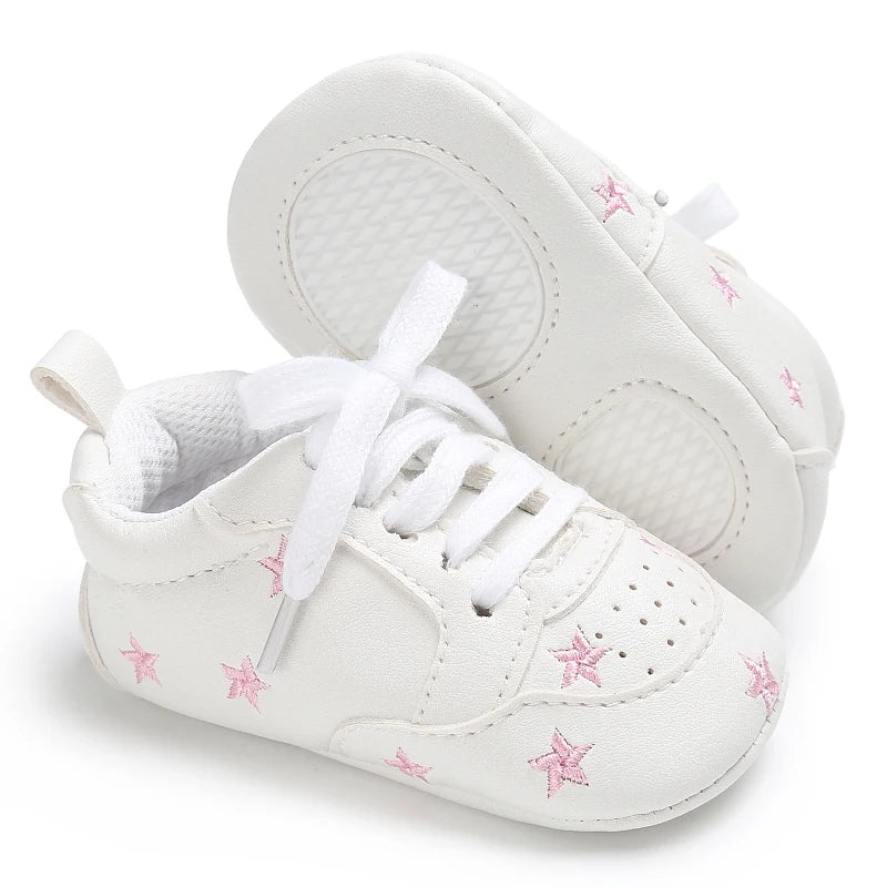Baby girl soft sole crib shoes by Baby Bubble, first walker style, with pink and white design and comfortable soft soles.