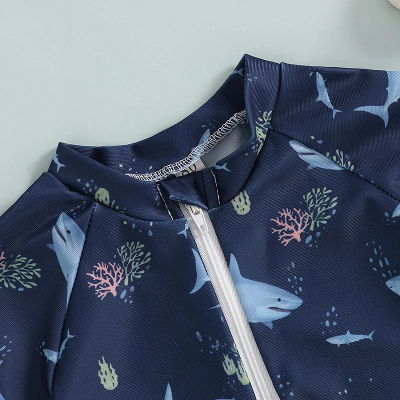 Baby Bubble shark print long sleeve rash guard with zip-up front, designed for babies, featuring a fun shark pattern for sun protection.