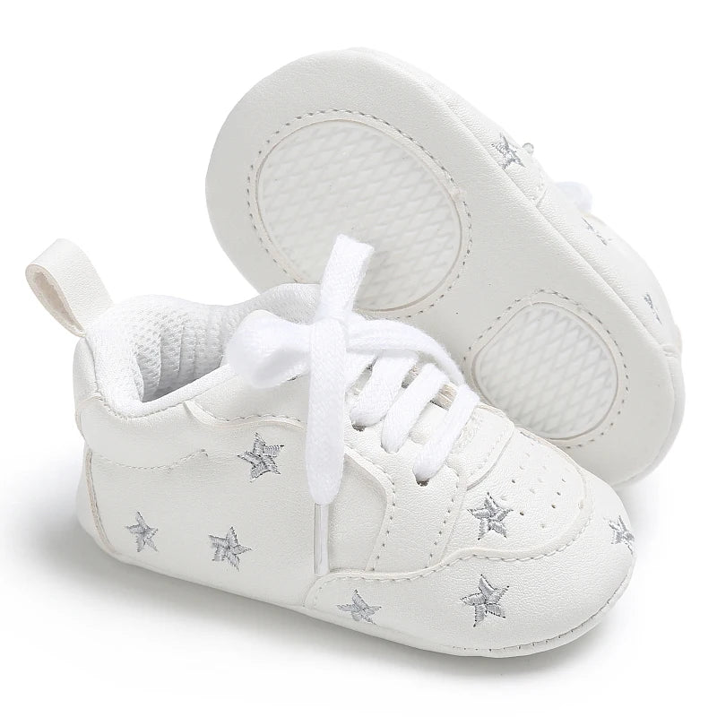 Baby girl soft sole crib shoes in pink with cute bow detail, designed for first walkers by Baby Bubble.