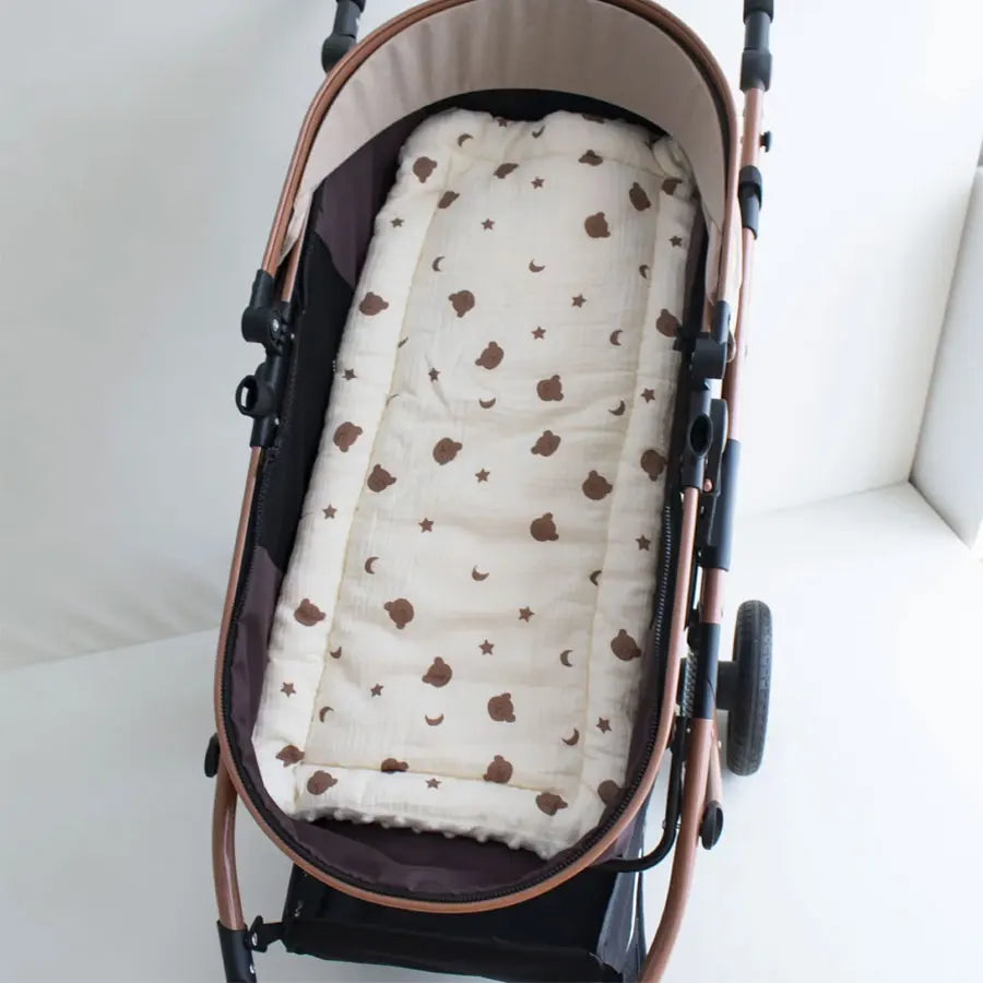 Soft cartoon baby stroller strap cover with shoulder pad from Baby Bubble, provides comfort and protection for little one's shoulders.