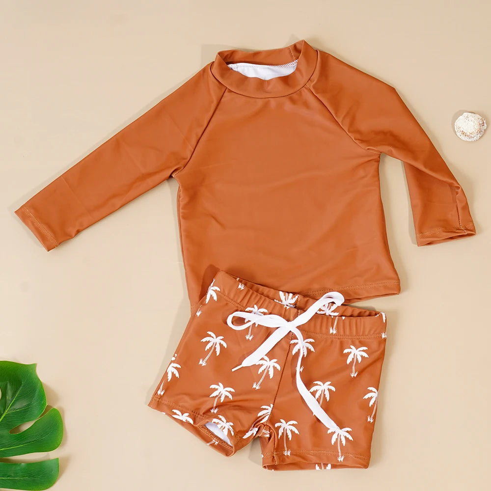 Baby boys' 2-piece swimsuit set by Baby Bubble featuring a cool print, includes a rash guard top and swim shorts for summer fun.