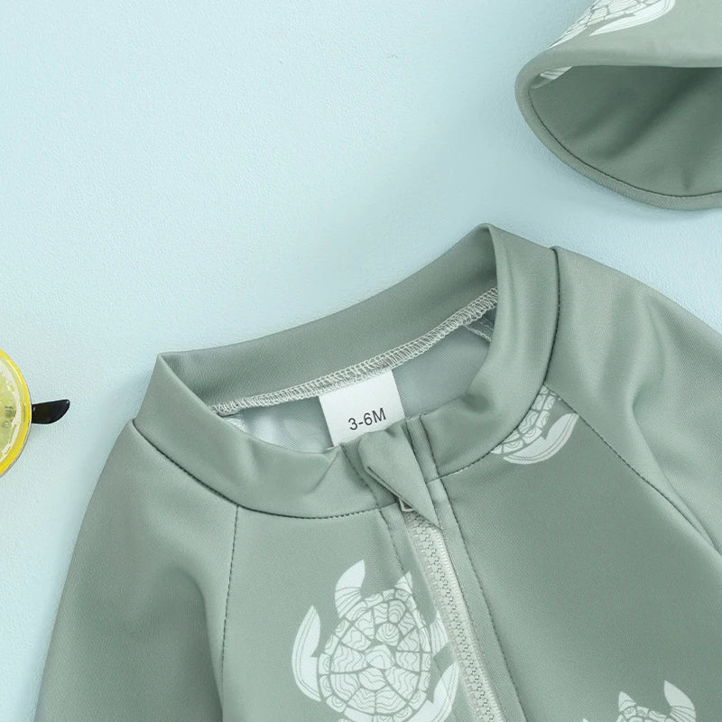 Baby boys rash guard set with turtle and dinosaur print by Baby Bubble, featuring colorful, lightweight sun protection for infants.