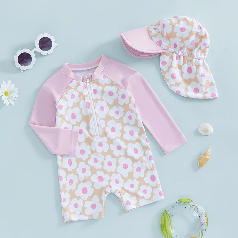 Baby girls rash guard set by Baby Bubble featuring floral and flamingo print, with long sleeves and matching swim bottoms.