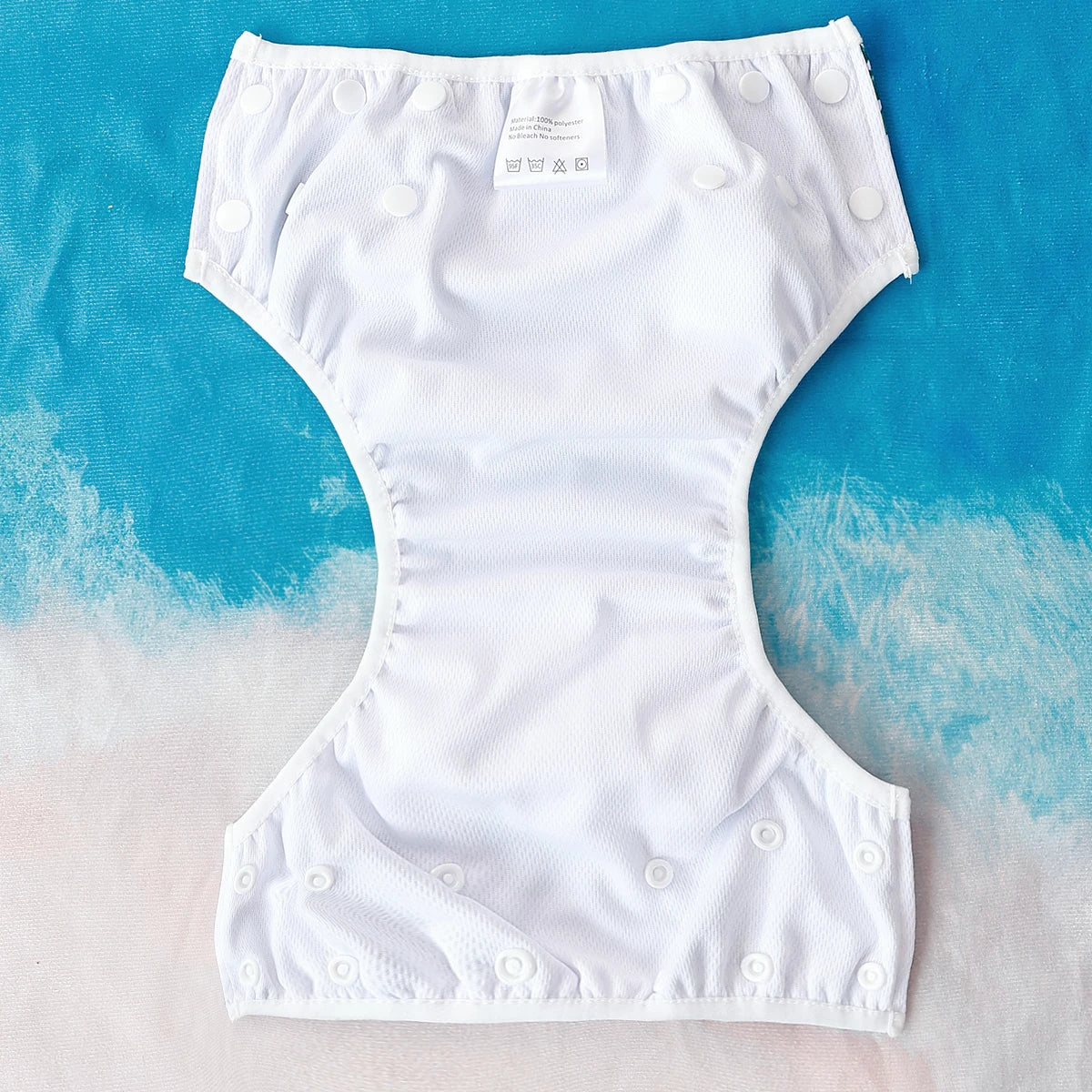 Baby Bubble washable baby swim diapers with adjustable fit, shown in a close-up of the waterproof fabric and adjustable waist.