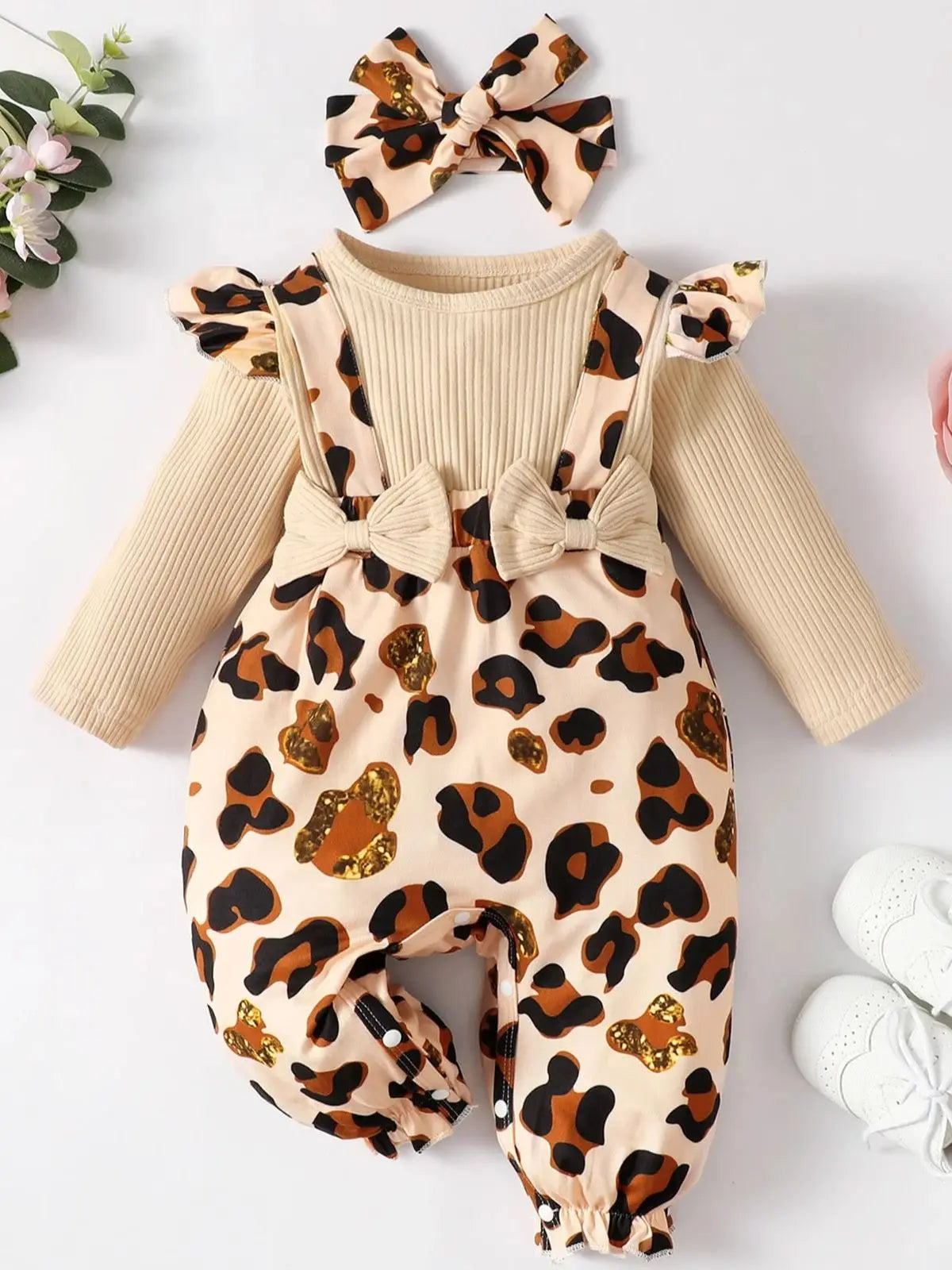 Baby girl leopard jumpsuit set by Baby Bubble with ruffle trim and matching headband, featuring a stylish animal print.