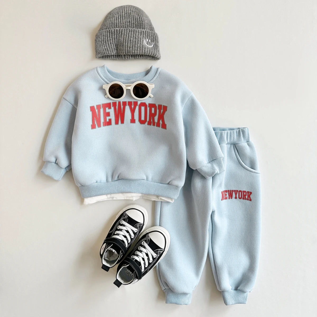 Baby Bubble baby winter outfit with a New York print top and matching pants, perfect for cold weather.