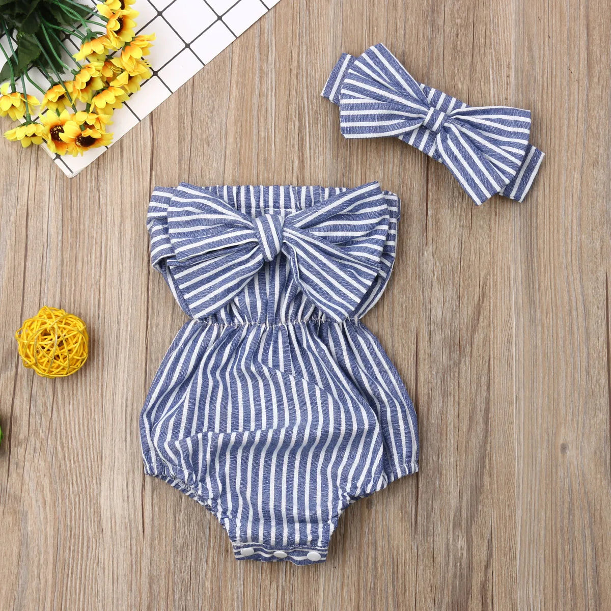 Baby girl summer romper by Baby Bubble featuring adorable stripe design, lightweight and perfect for warm weather.