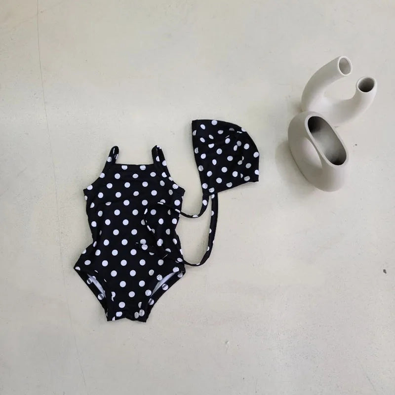 Baby girl swimwear set by Baby Bubble, one-piece swimsuit with matching sun hat for infants, featuring colorful patterns and lightweight fabric.