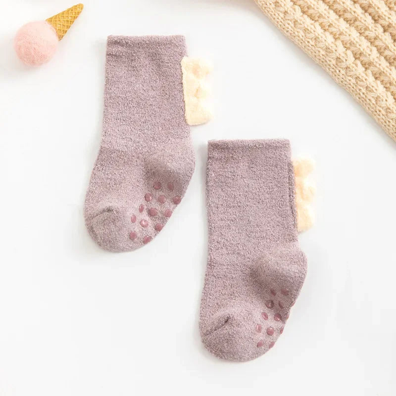 Baby Dinosaur Socks by Baby Bubble, soft and warm baby socks featuring colorful dinosaur designs for infants.