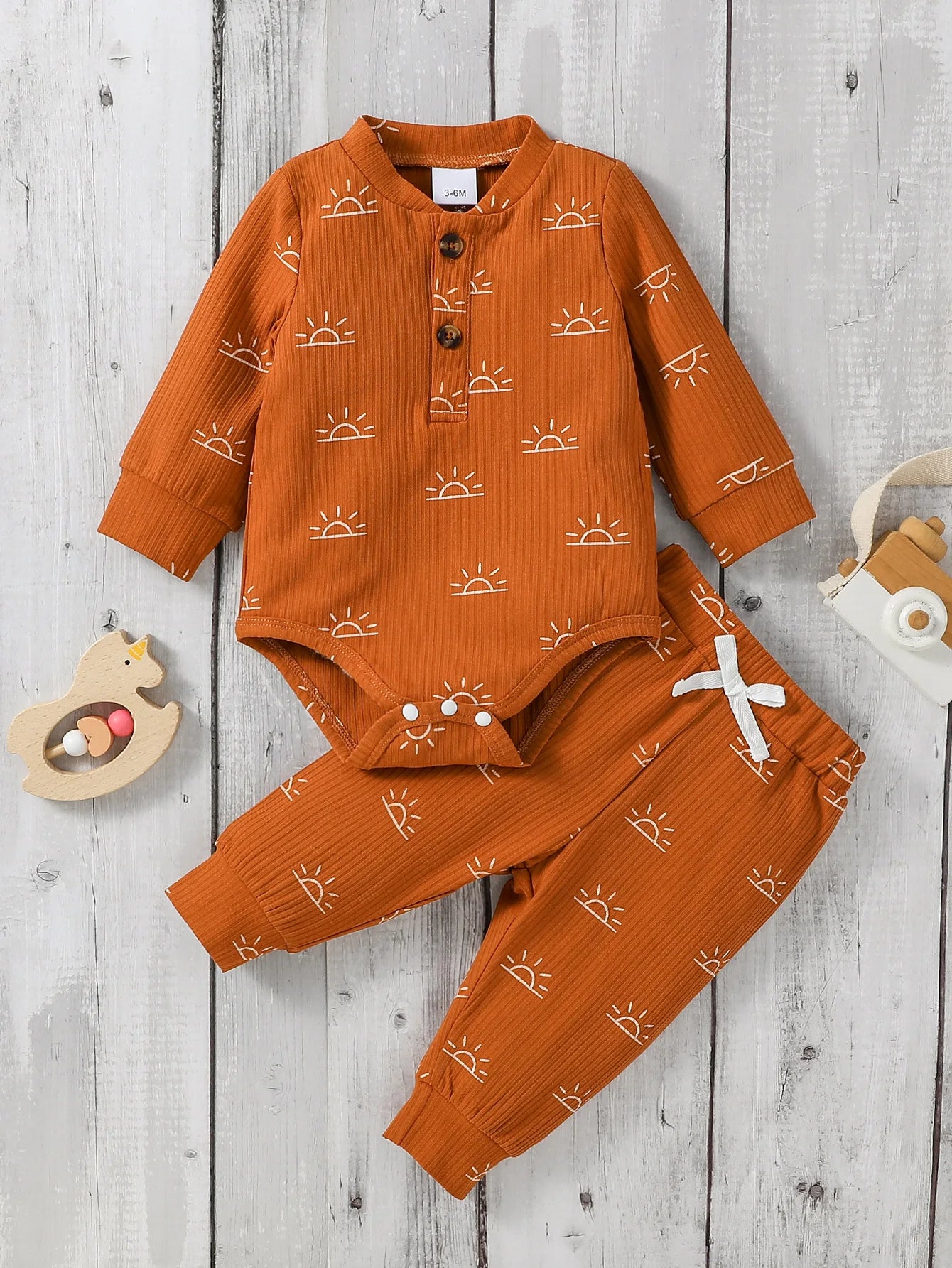 Baby Boy 2-piece outfit with a cute jumpsuit and matching pants from Baby Bubble, featuring soft fabric and playful design.