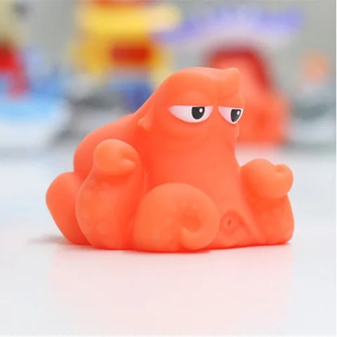 Baby Bubble baby bath squirt toys set with squeaky, floating animal toys including ducks and whales in bright colors.