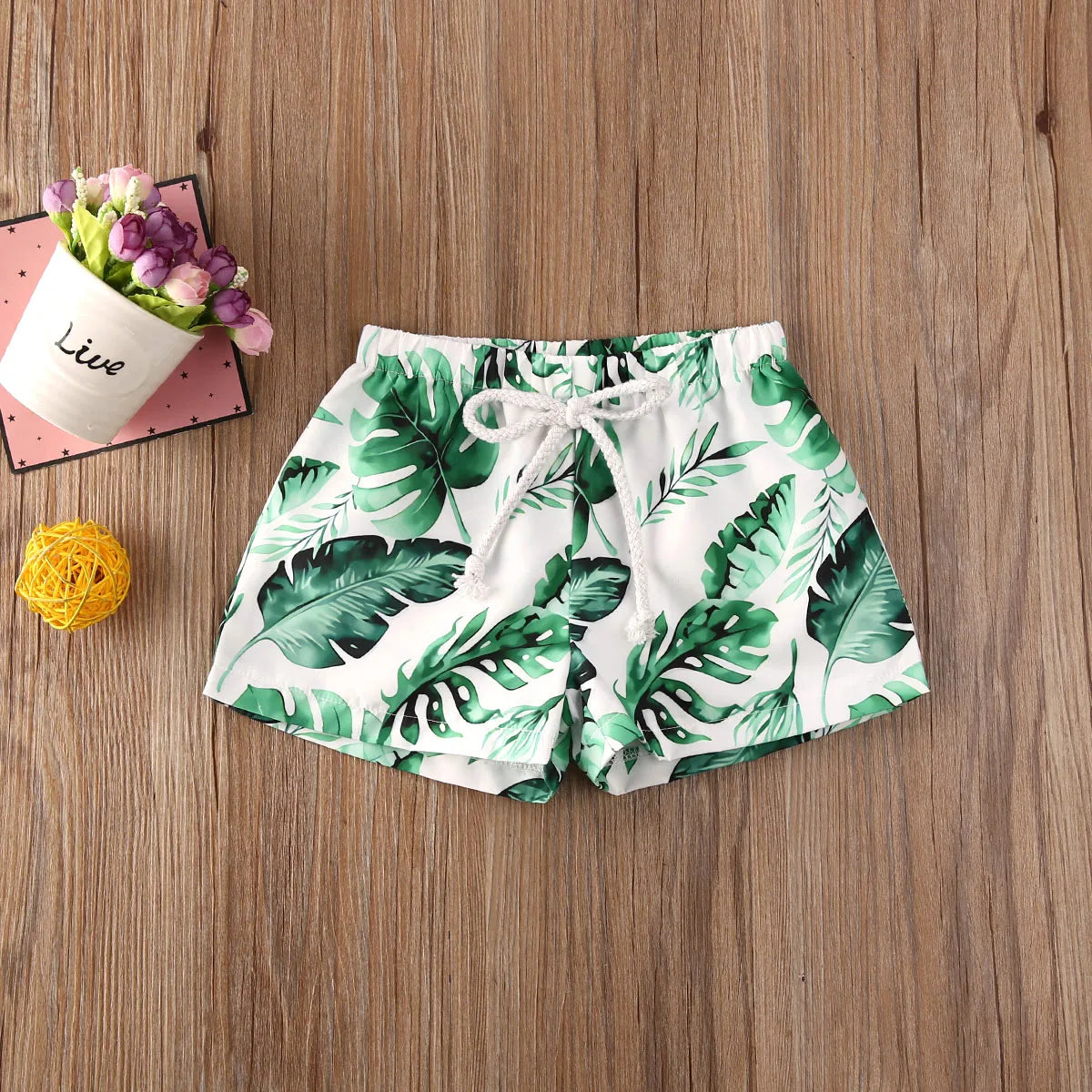 Kids swim shorts by Baby Bubble, quick-dry fabric with UV protection, featuring colorful patterns and adjustable waistband.
