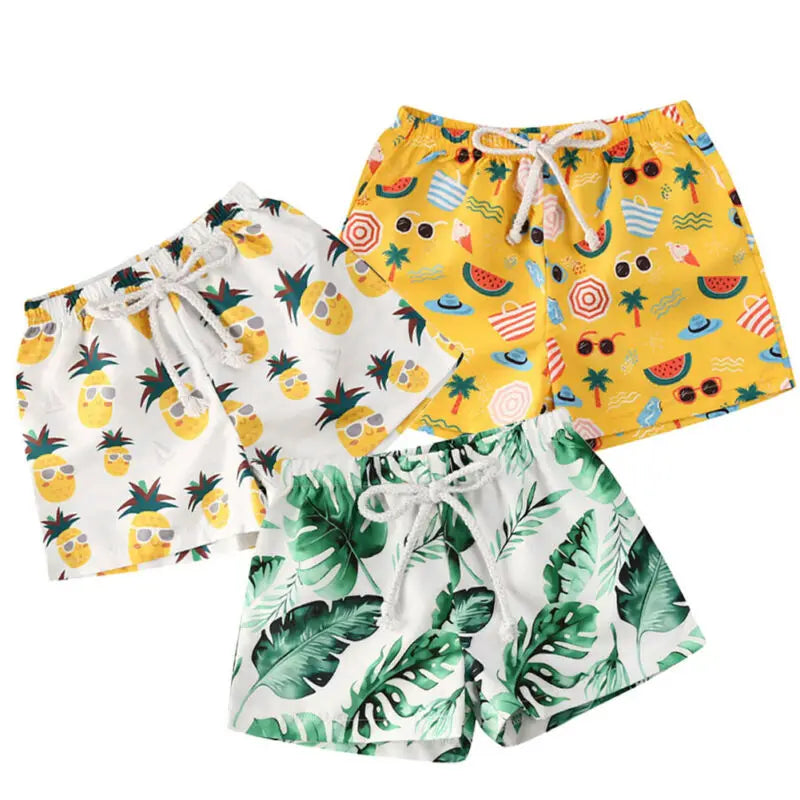 Kids swim shorts by Baby Bubble featuring quick-dry fabric and UV protection, shown in vibrant blue with an elastic waistband.