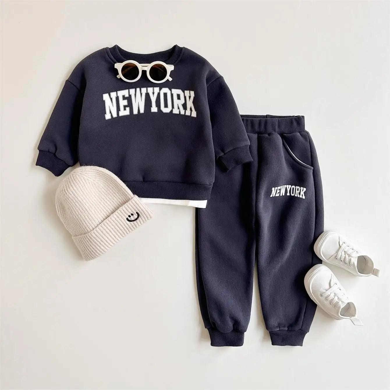 Baby Bubble 2-piece winter outfit with New York print top and matching pants, cozy and stylish for cold weather.
