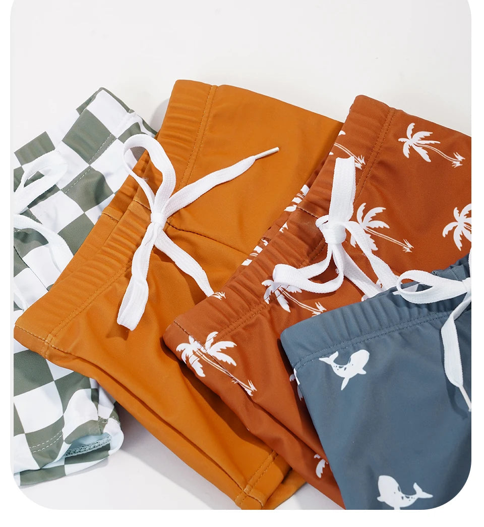Baby boys' 2-piece swimsuit set with cool print by Baby Bubble, featuring a lightweight swim top and matching shorts.
