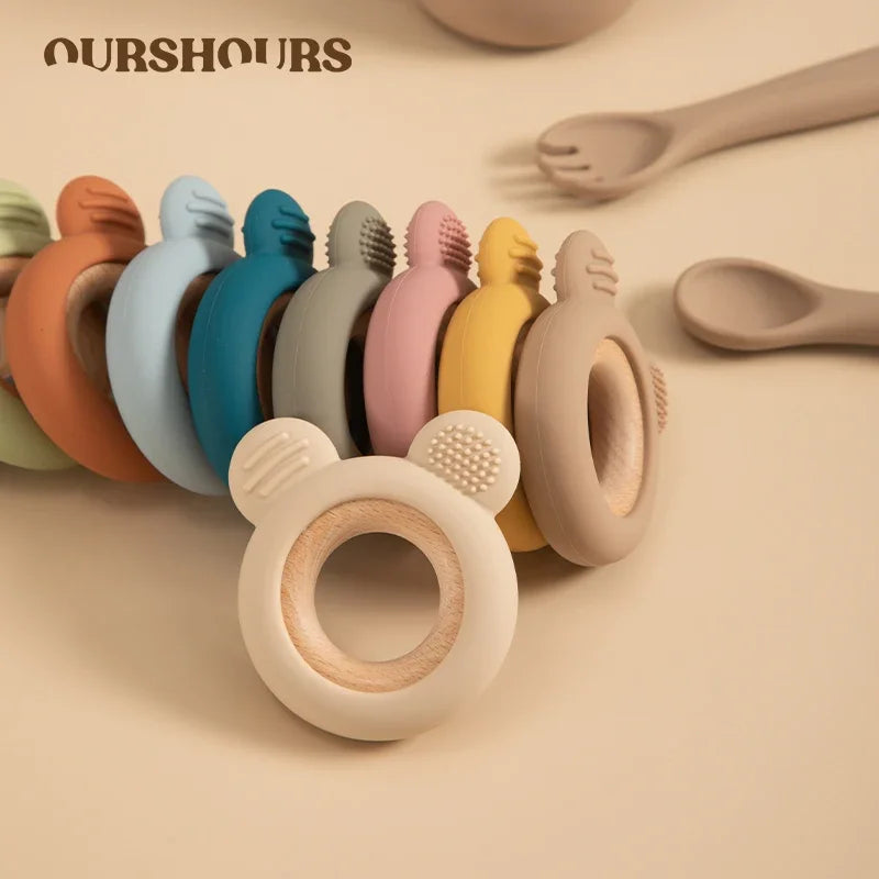 Baby Bubble silicone wood teether ring in natural wood and soft silicone, designed for soothing and safe teething comfort.