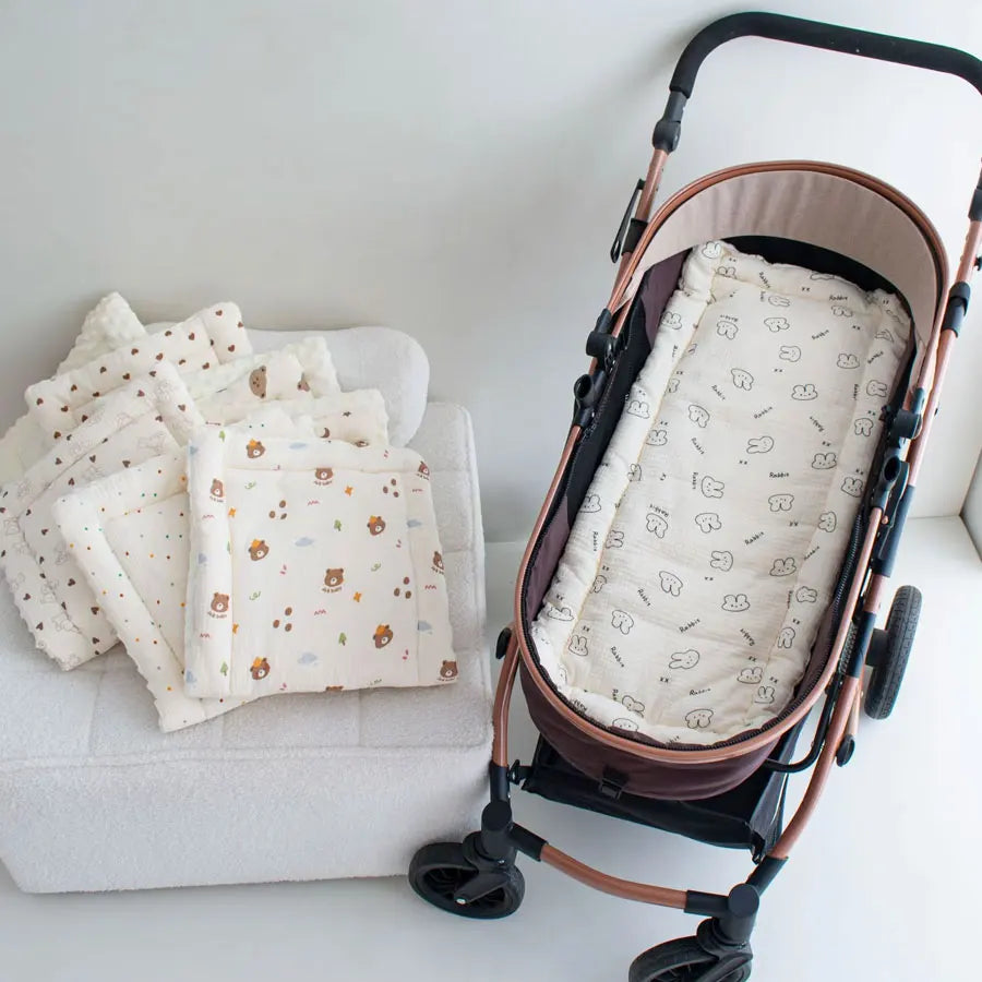 Soft cartoon-themed baby stroller strap cover by Baby Bubble, plush shoulder pad for comfortable stroller use.