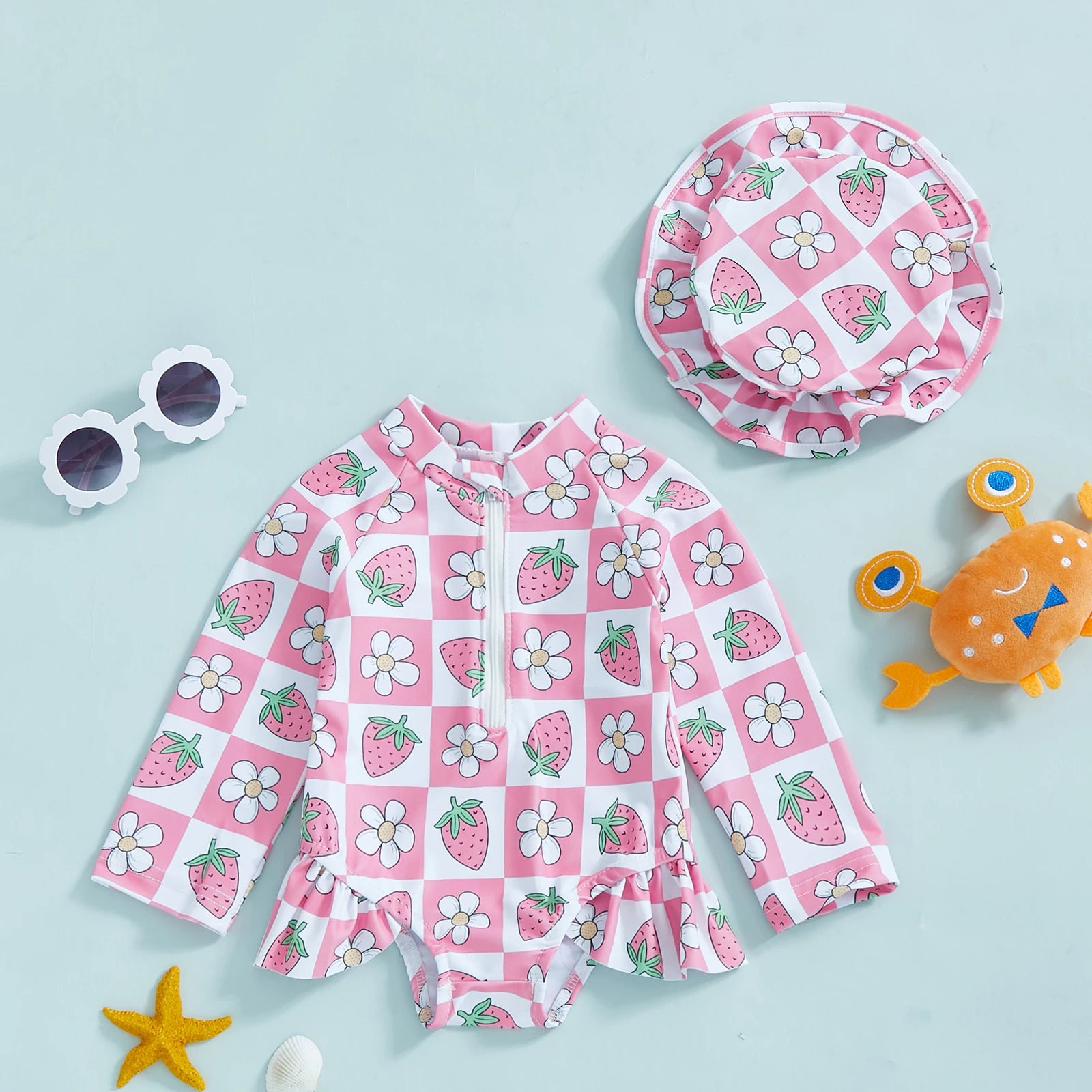 Baby girl floral rash guard with hat by Baby Bubble, zip-up swimsuit featuring colorful floral pattern and sun protection hat.