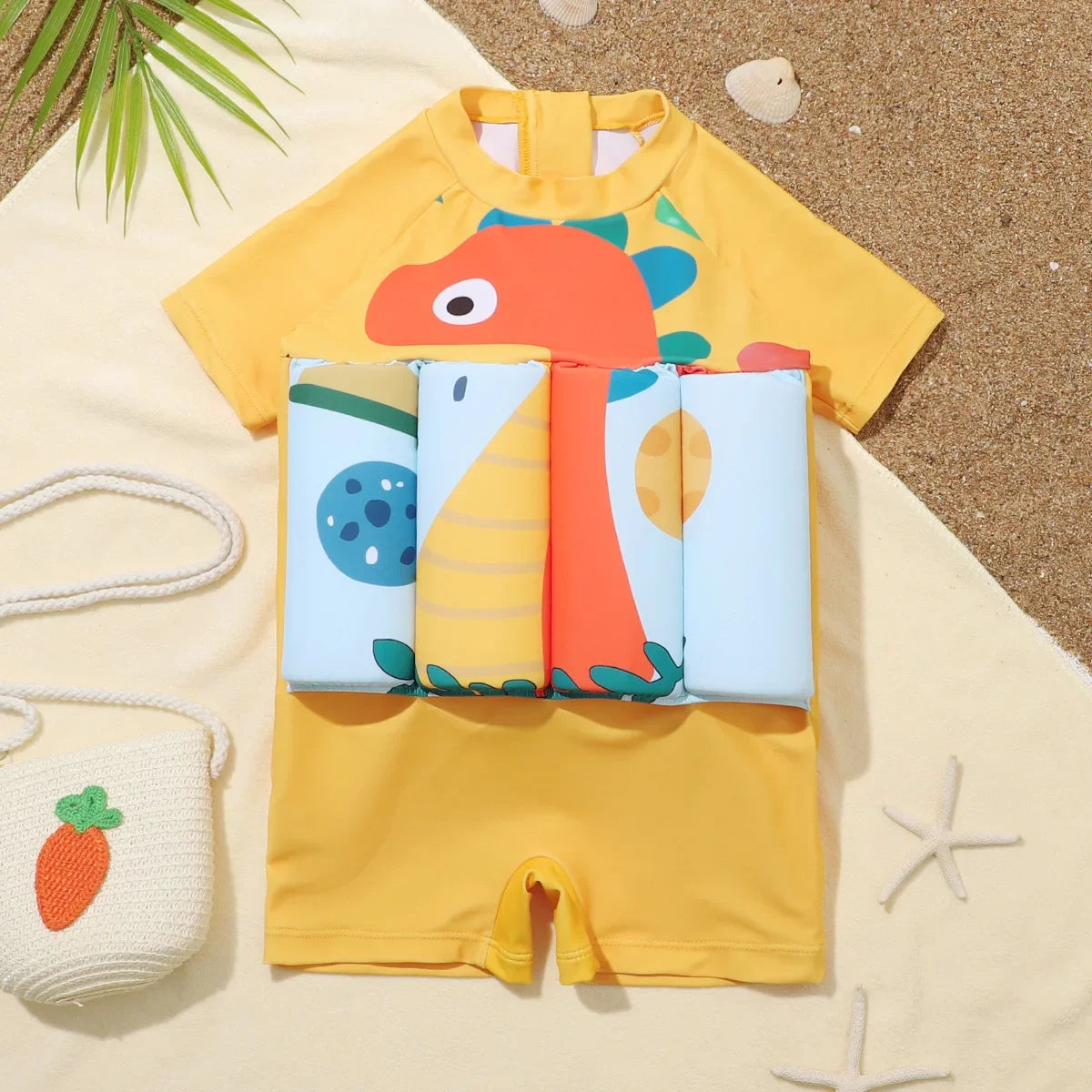 Children's buoyancy swimsuit with cartoon print by Baby Bubble, featuring colorful design and adjustable straps for swimming safety.