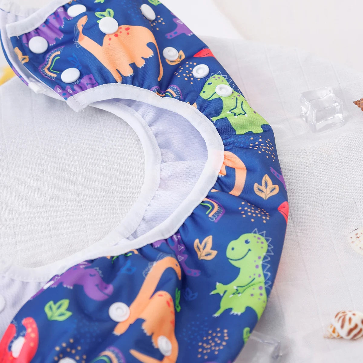 Reusable Baby Swim Diapers with playful animal prints by Baby Bubble, designed for infant swimming and water play.